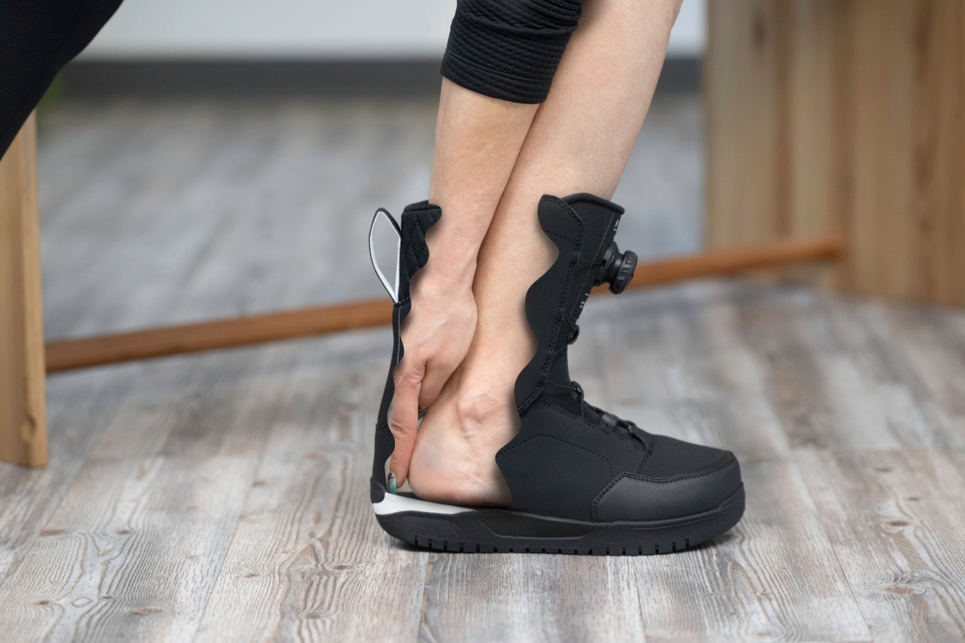 One finger behind the heel