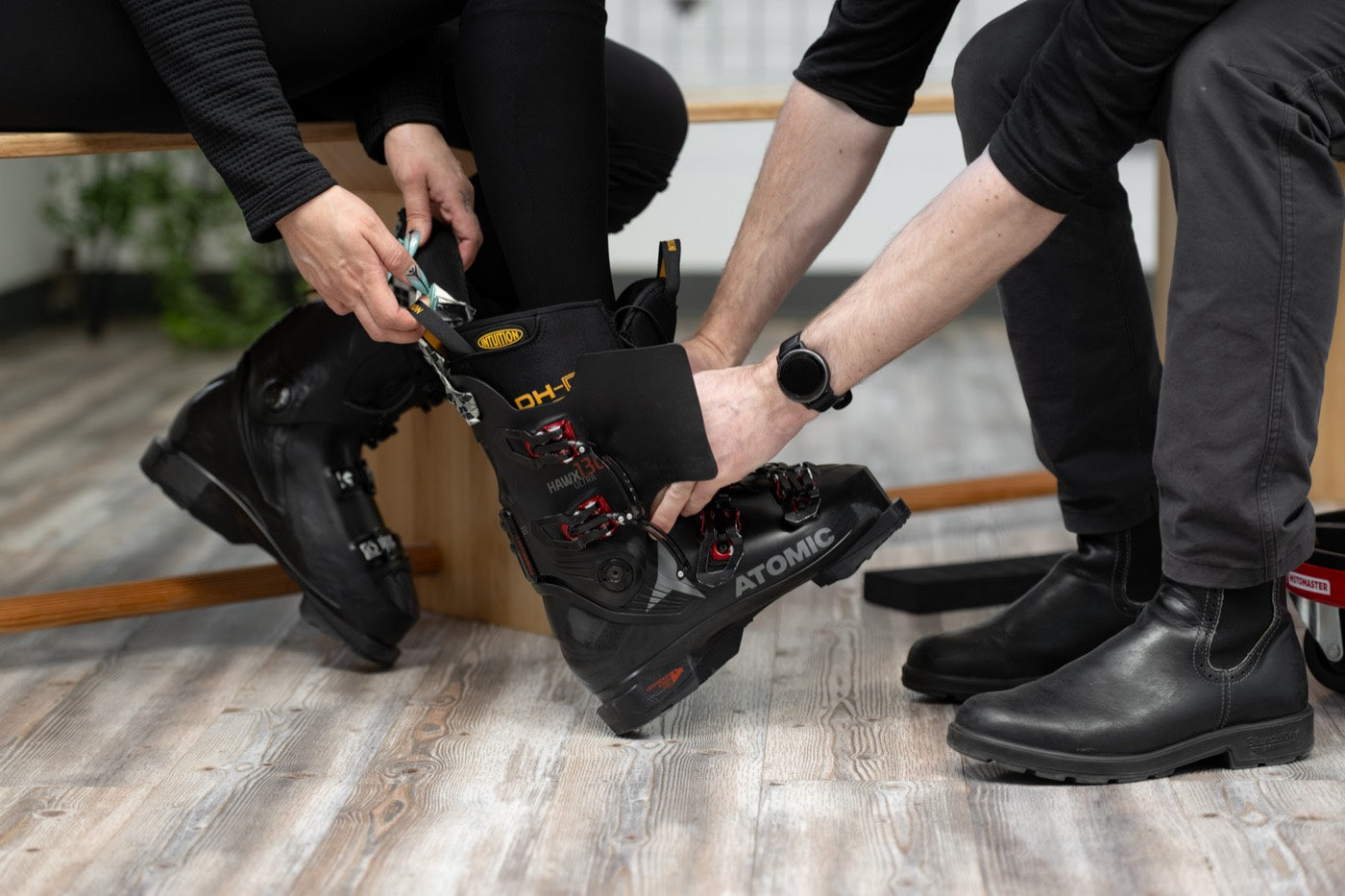 Helping the customer into the heated boot